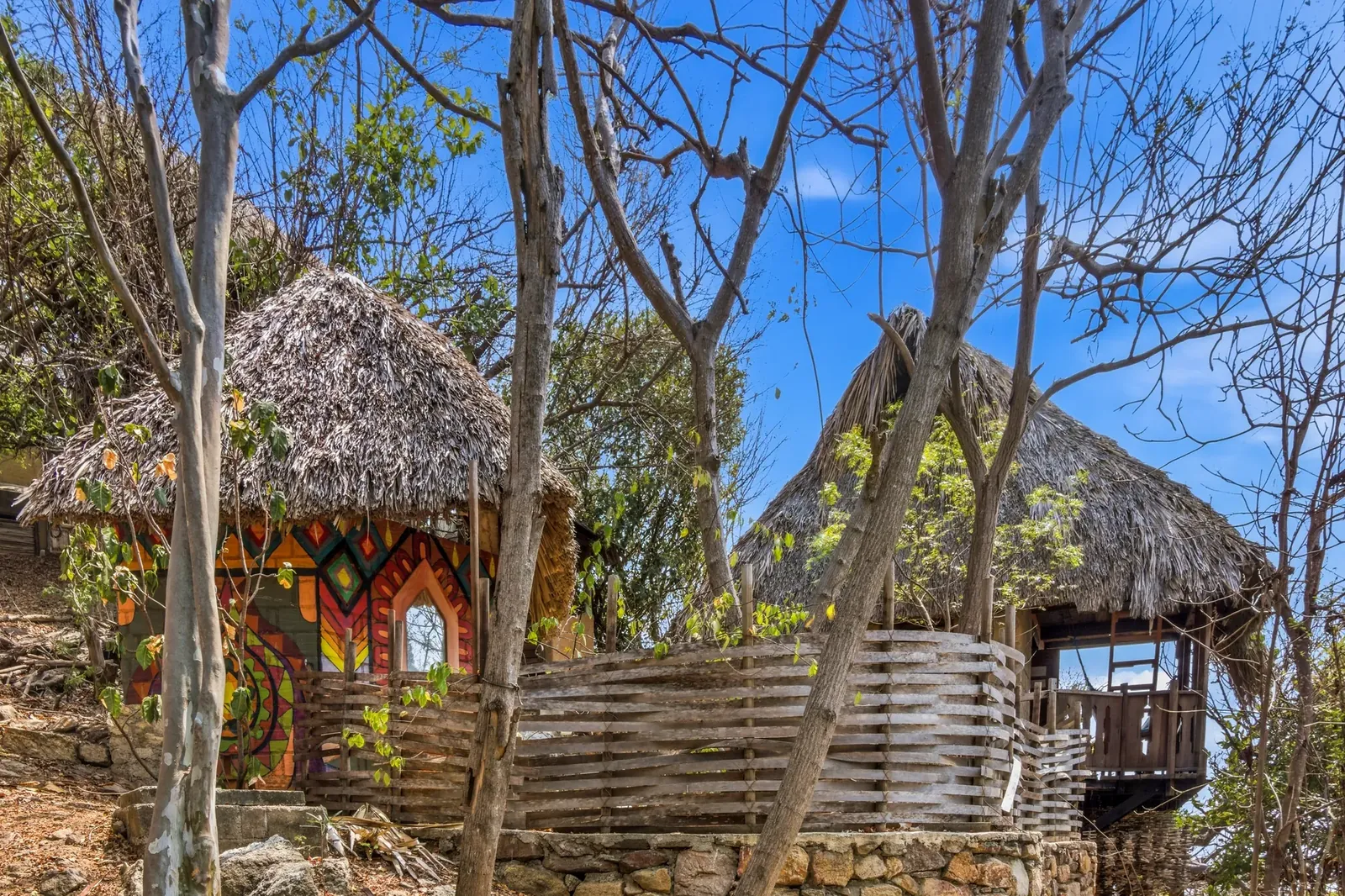 Hand-painted cabin with vibrant Oaxacan murals tucked in the jungle